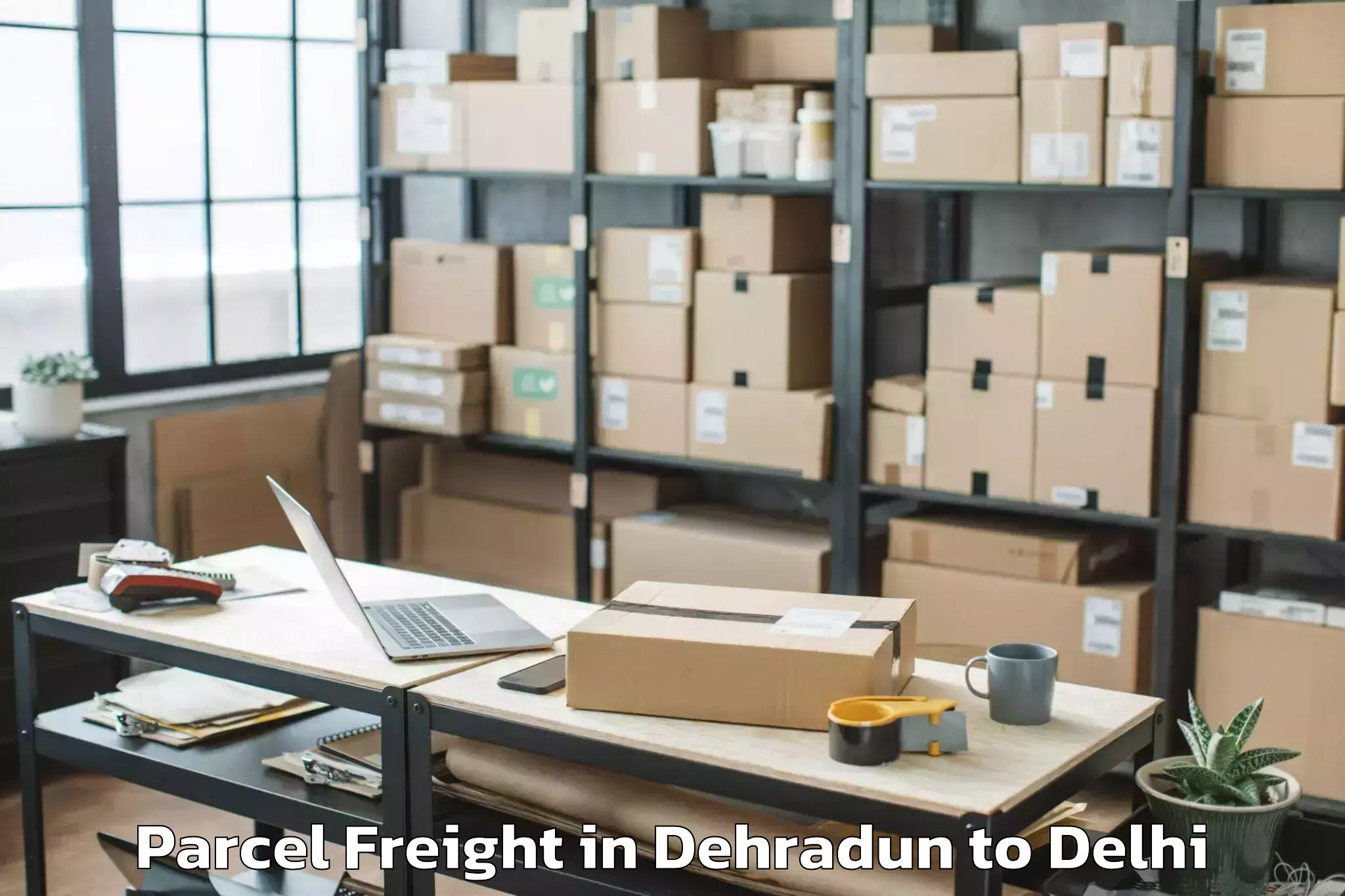 Book Dehradun to Burari Parcel Freight Online